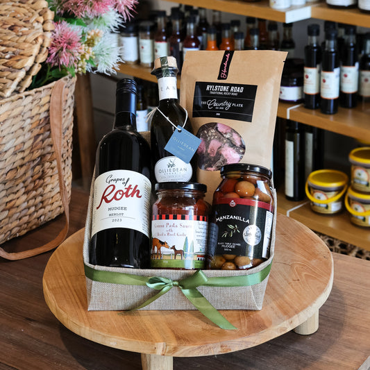 The quintessential hamper of
Mudgee Region goodness.

Wine that won’t be stored
away later and a range of complementing products.

All up a bundle of delicious
delights from just a few of our many local producers.

Recommended to be enjoyed
with good company for optimum enjoyment.